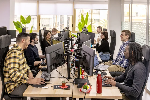 Team laughing at desk